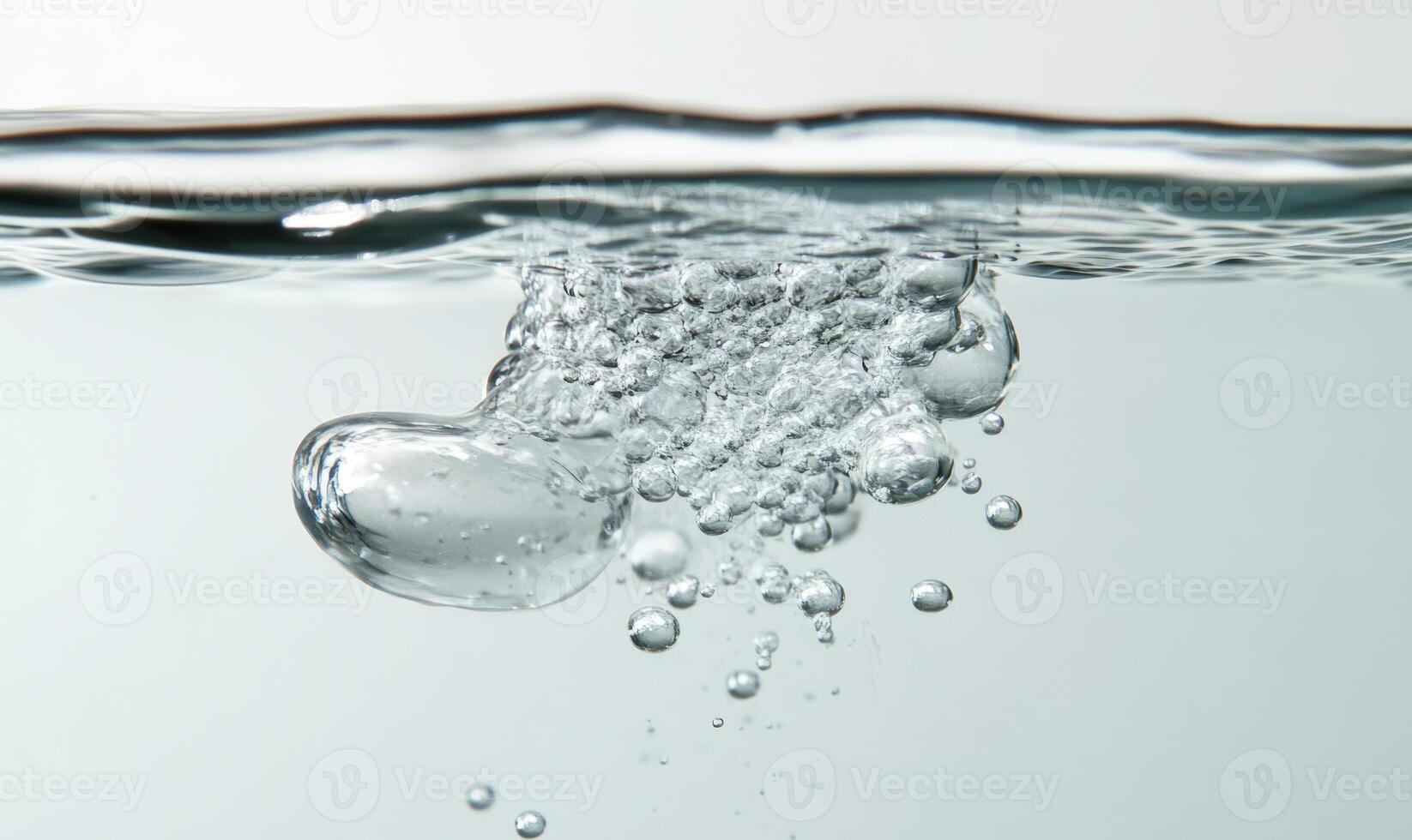 Dissolving pill in clear water, bubbles rising, close-up photo