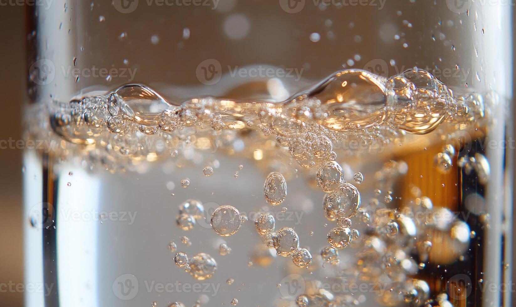 Close-up of dissolving tablet in water, effervescent bubbles forming photo