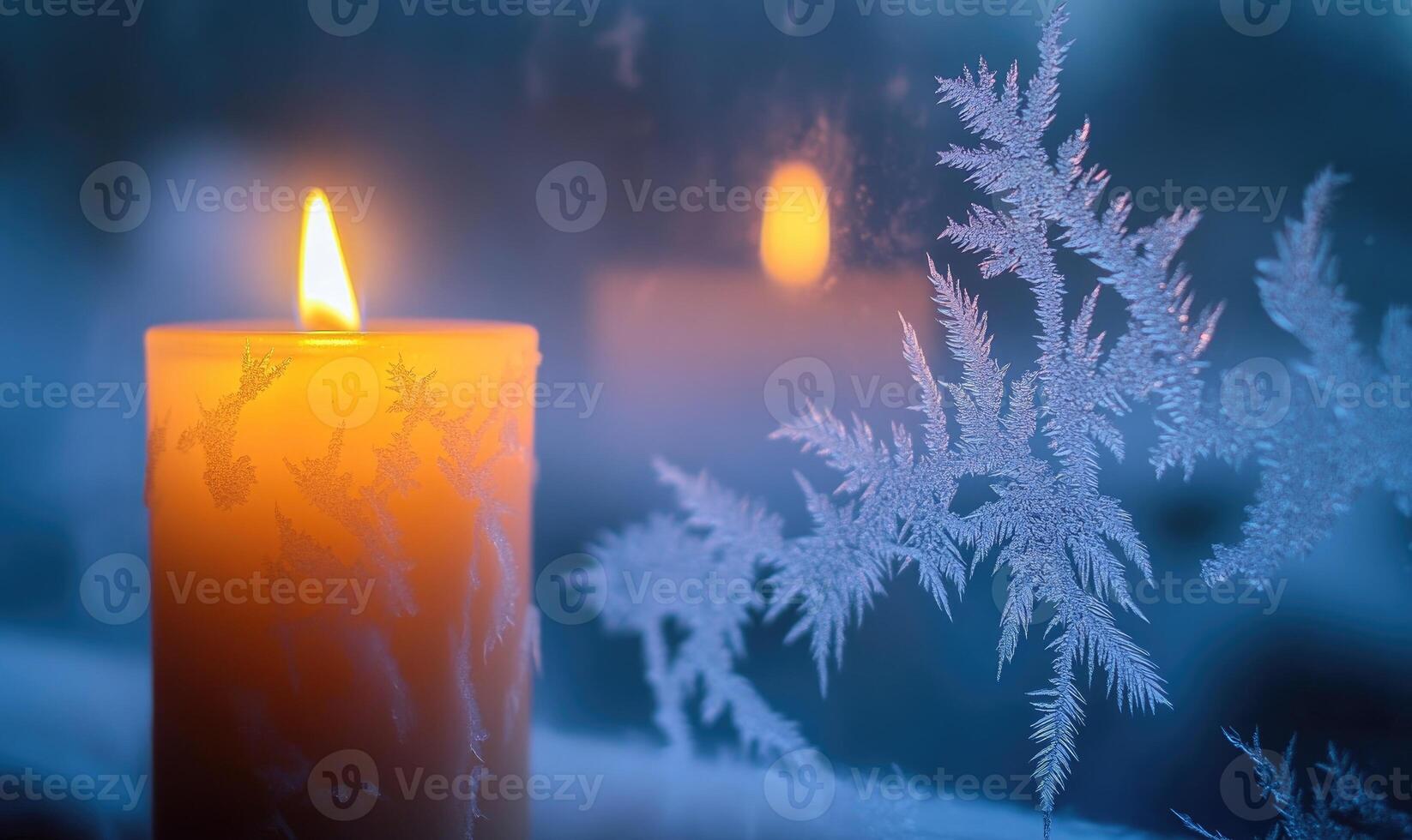 A candle is lit in front of a window with frosted glass photo