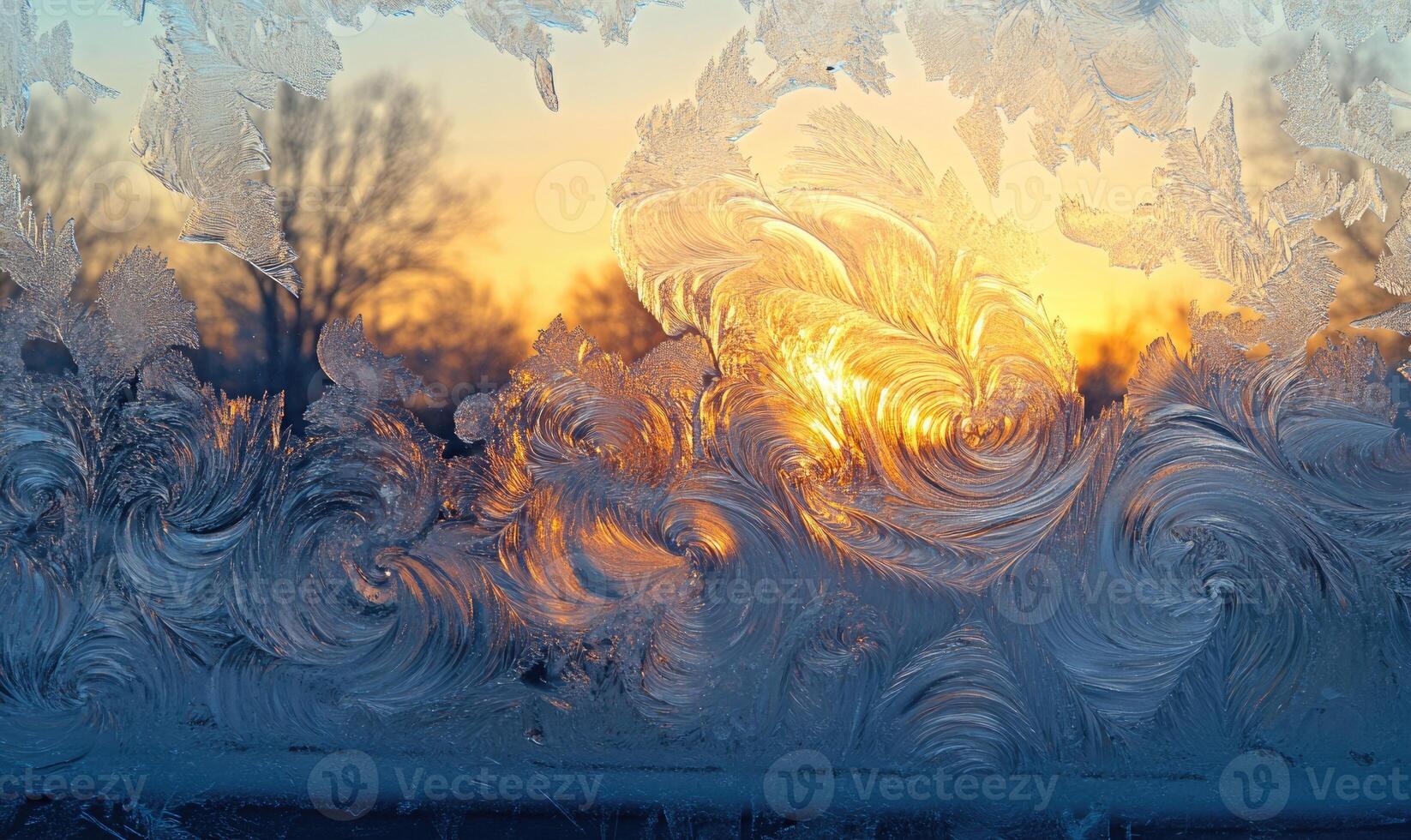 A window pane covered in frost with a sun in the background photo