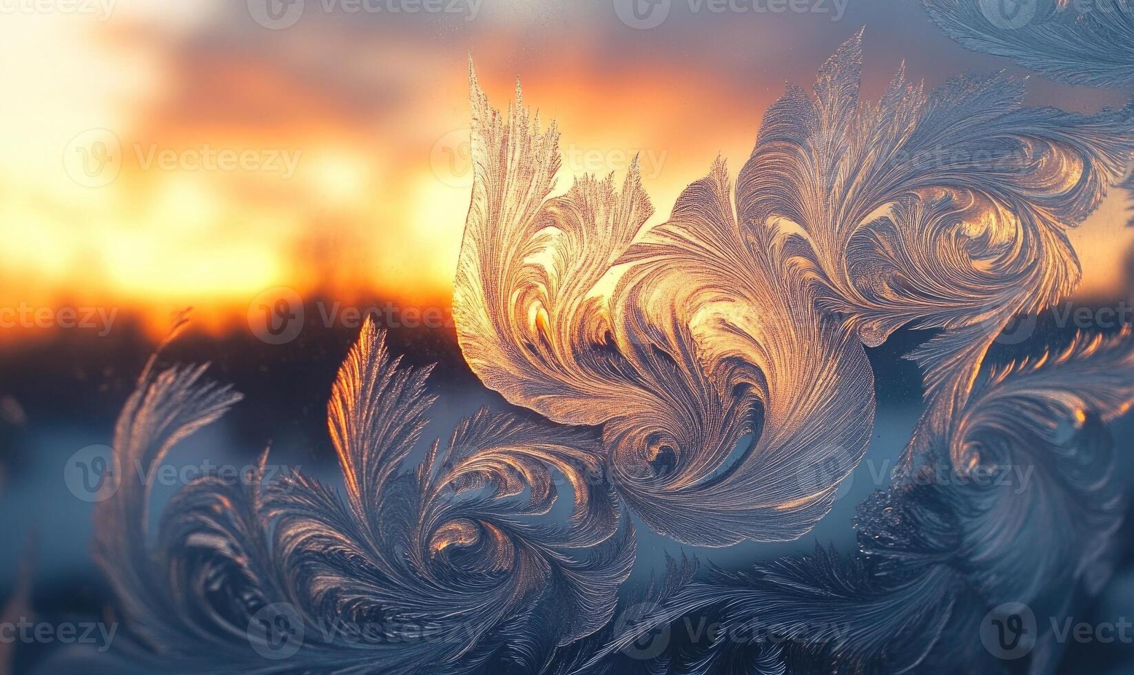 A frosty window pane with a sunset in the background photo
