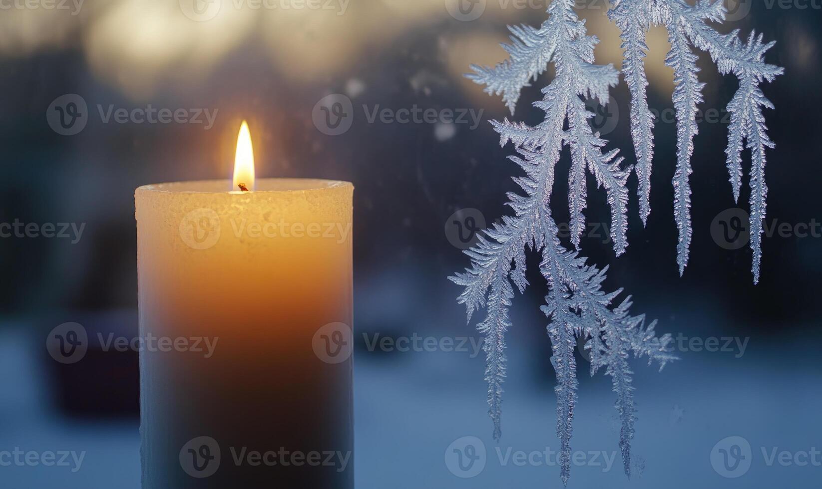 A candle is lit in front of a window with frosted glass photo