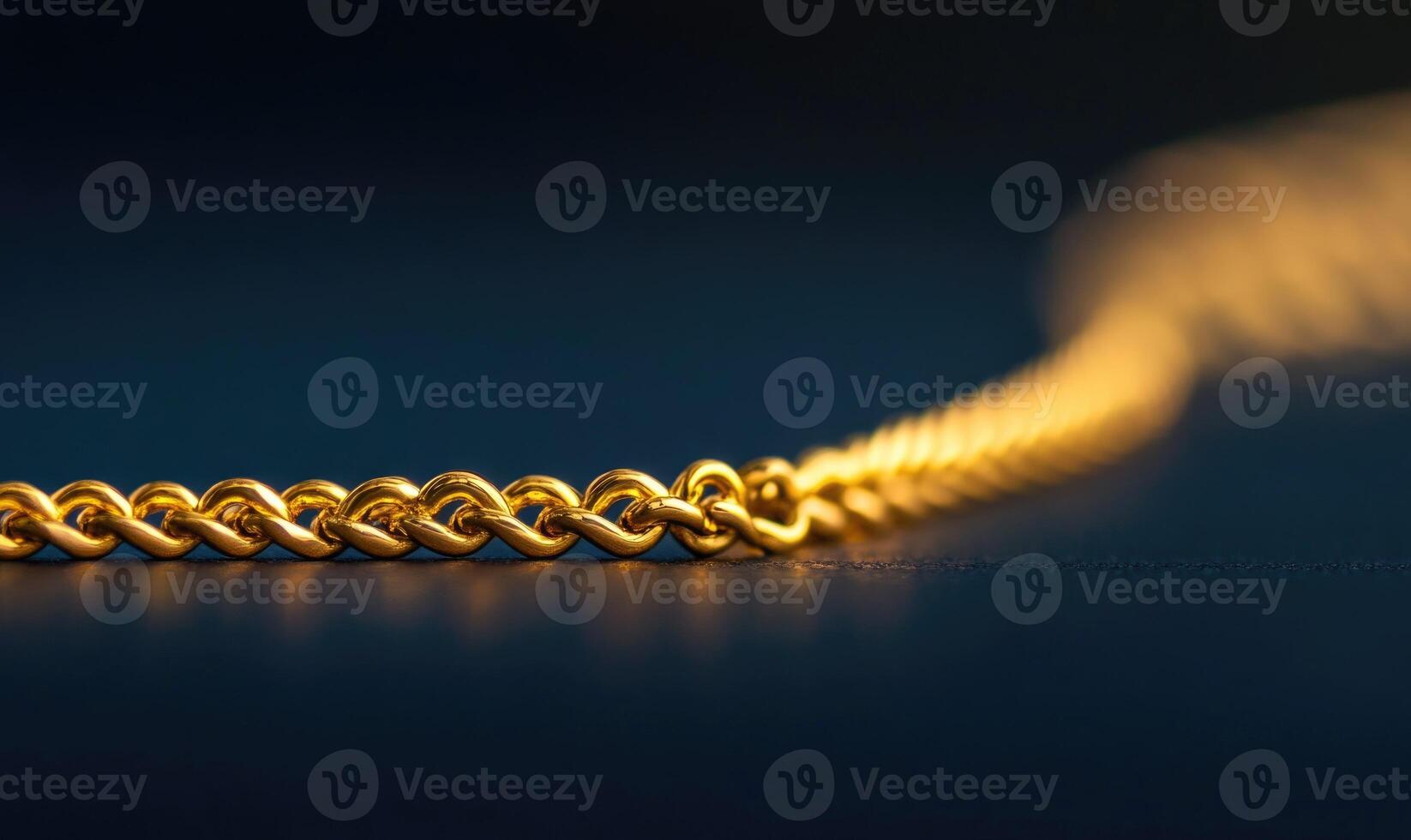 A gold chain with a clasp is shown in a close up photo
