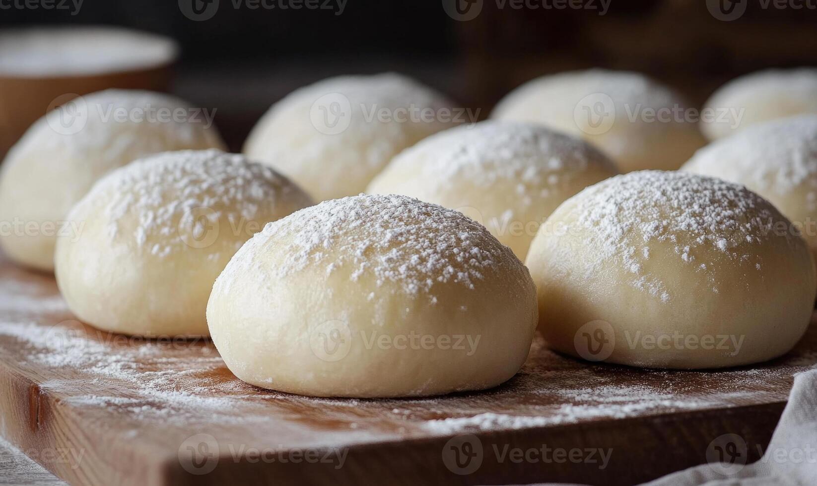 A close up of a table with a wooden surface and a pile of powdered sugar on it photo
