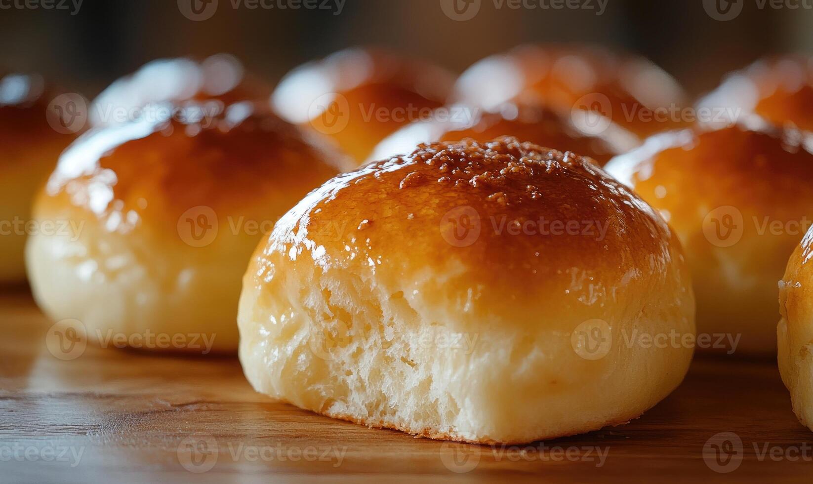A close up of a few brown pastries on a wooden table photo