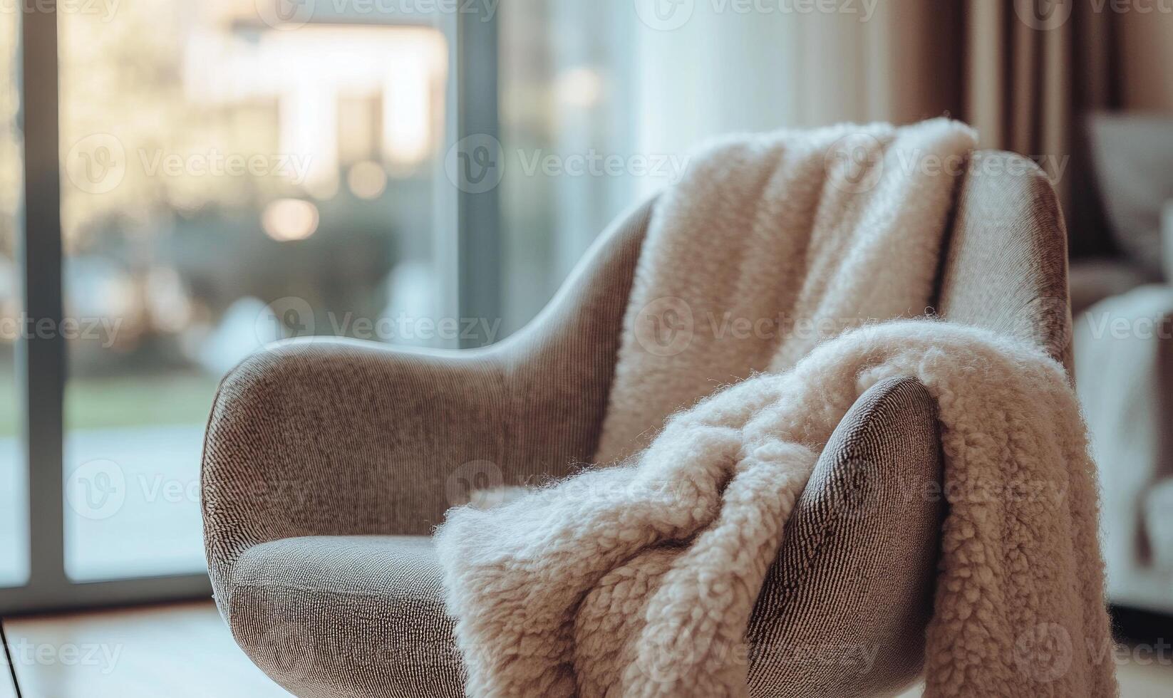 A chair with a white blanket draped over it photo