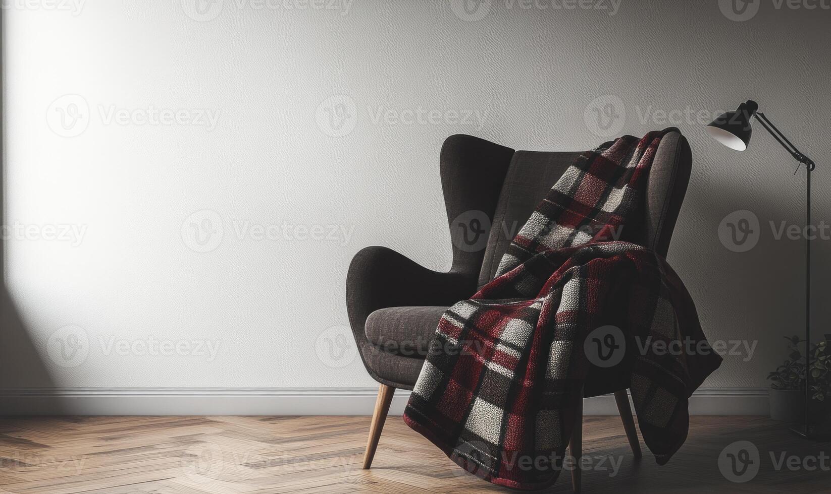 A chair with a red and black plaid blanket draped over it photo