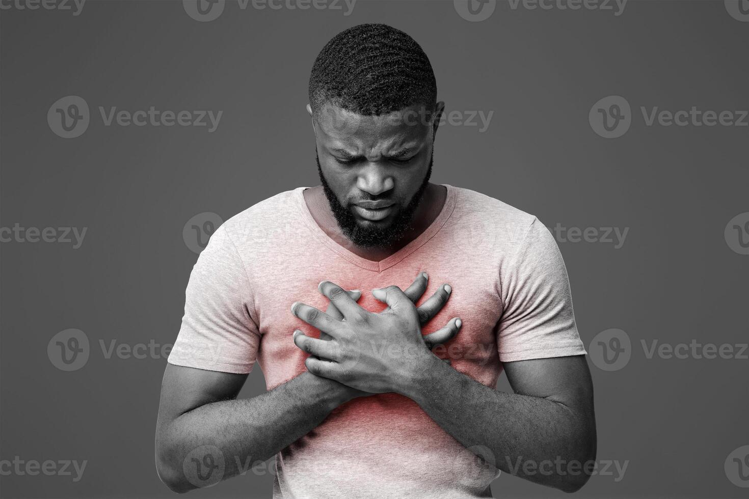 Sad young afro man suffering from acute pain in chest, white background photo