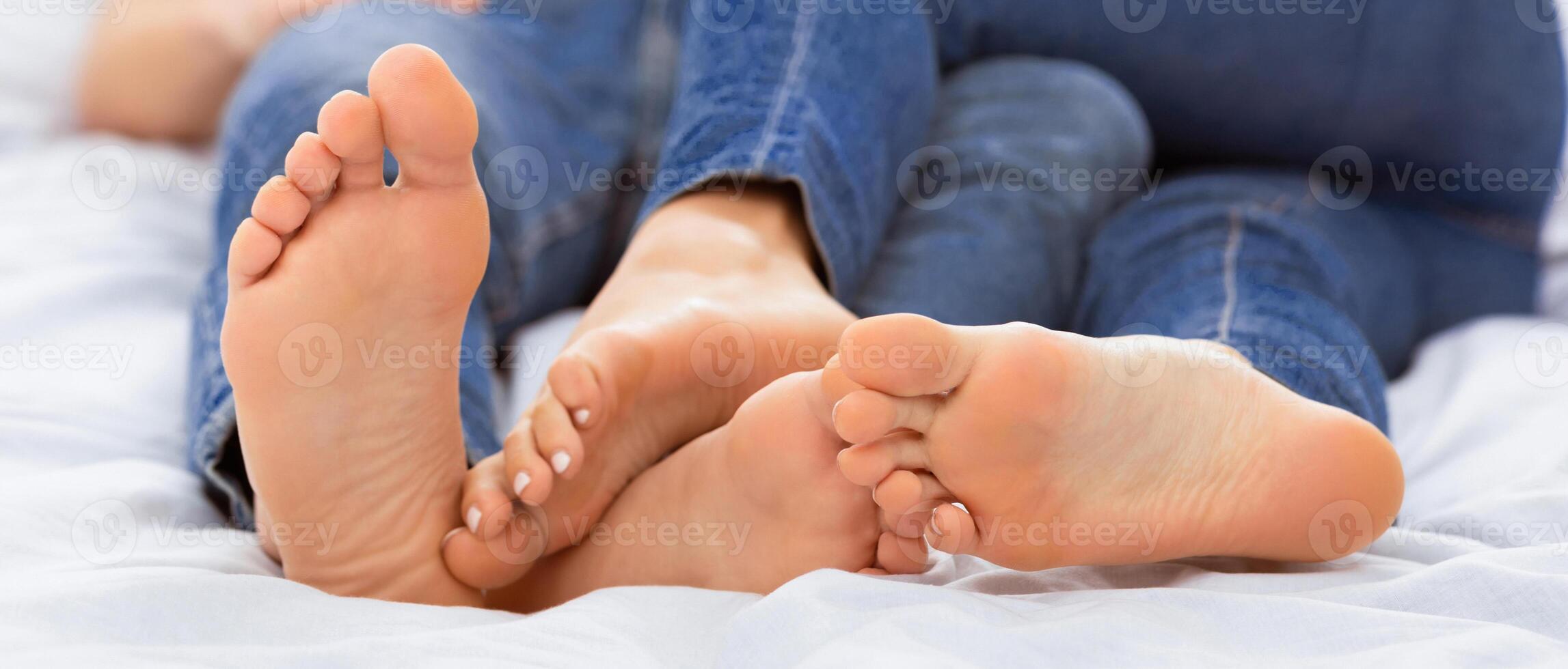 Romantic Relationship. Loving Couple Hugging Lying In Bed At Home. Shallow Depth, Selective Focus photo