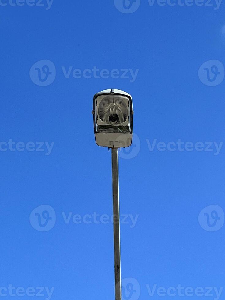 street light pole isolated on blue sky background photo