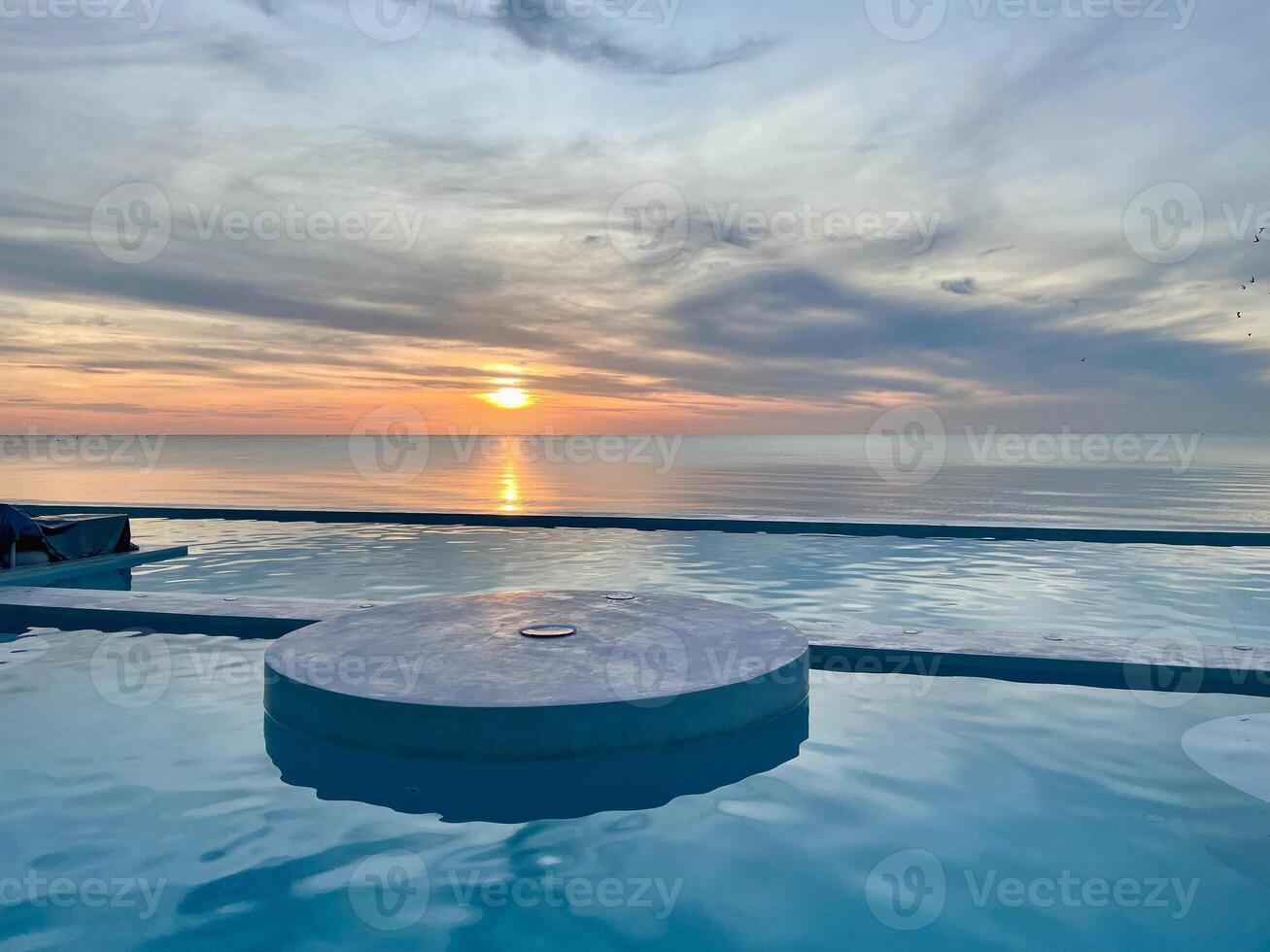 Beautiful sunset view from the pool in Andaman Sea, Thailand. photo