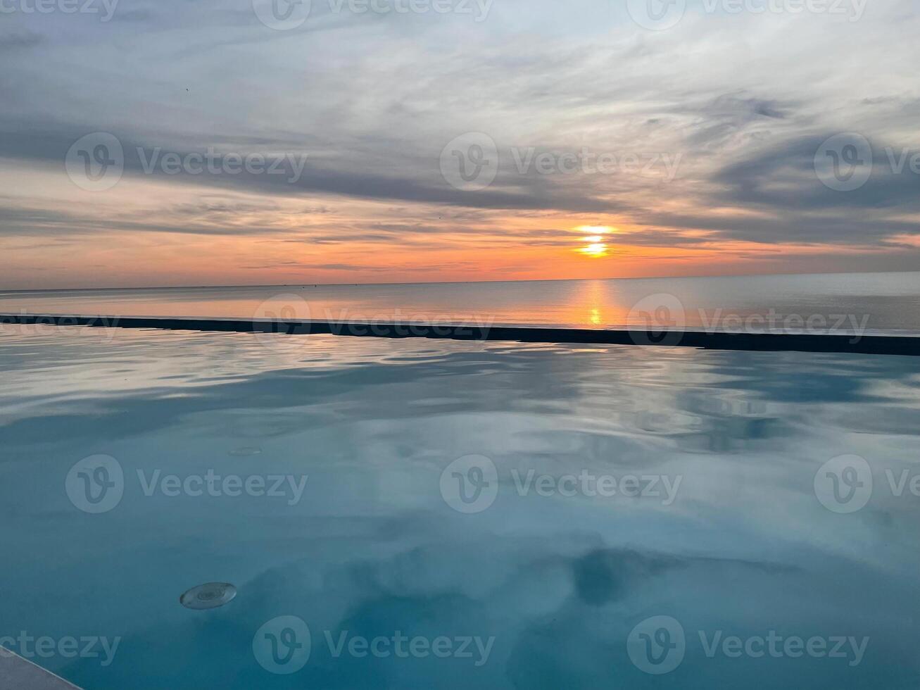 Beautiful sunset view from the pool in Andaman Sea, Thailand. photo