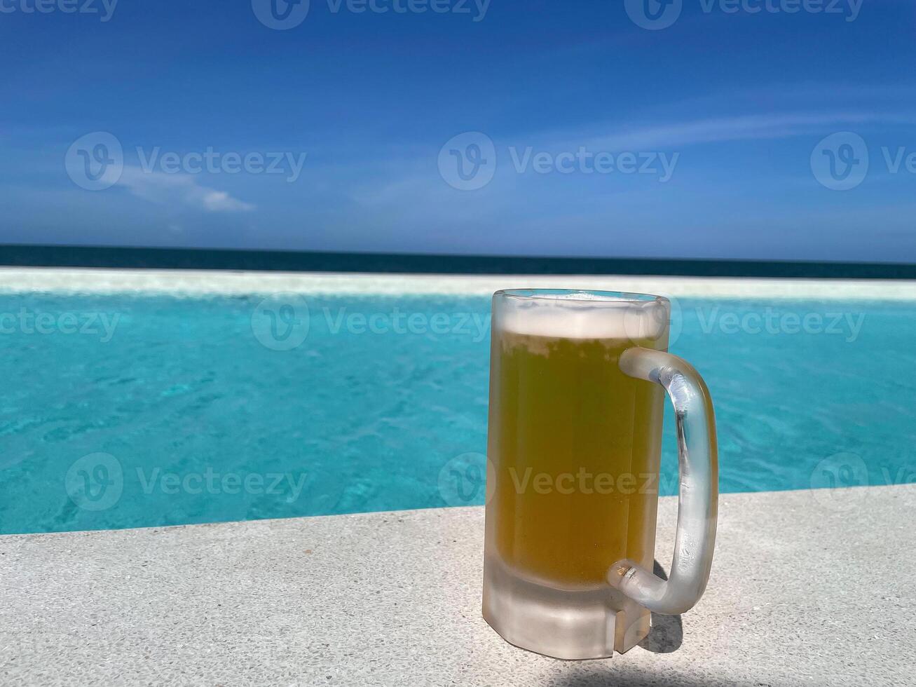 Beer, a Alcohol drink with a sea view. photo