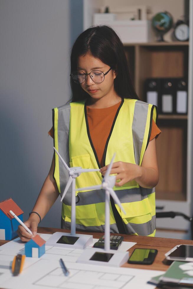 Female architect working at home She looked at the blueprint. photo