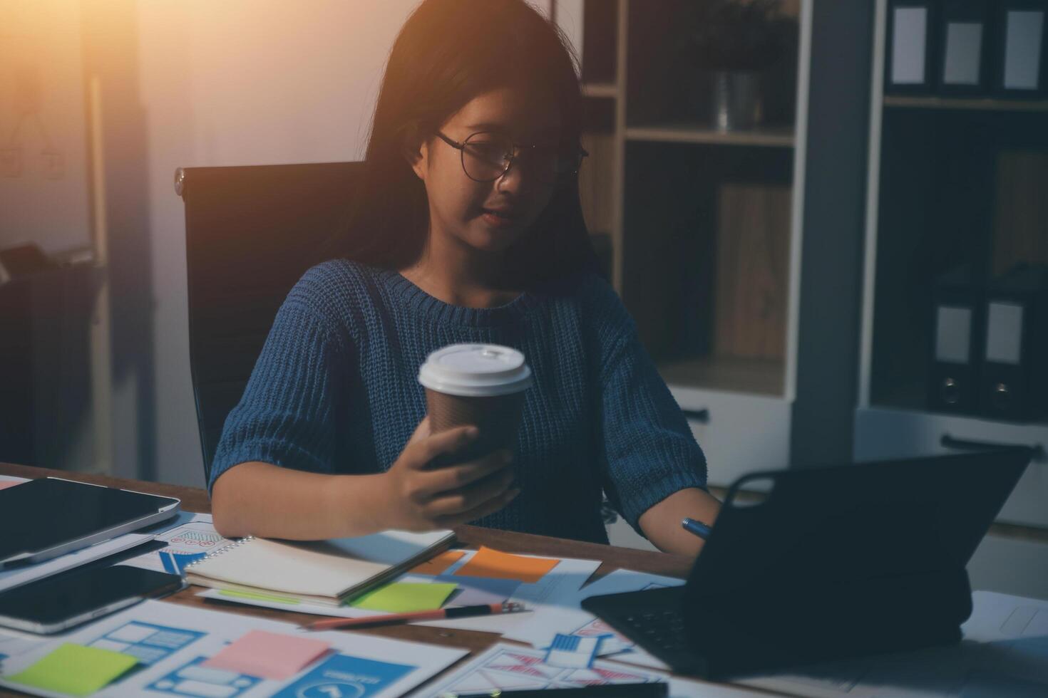 The designer team is designing the uxui system to make the uxui system work well on new phones and support system updates. Website development concept UI UX front end designer photo