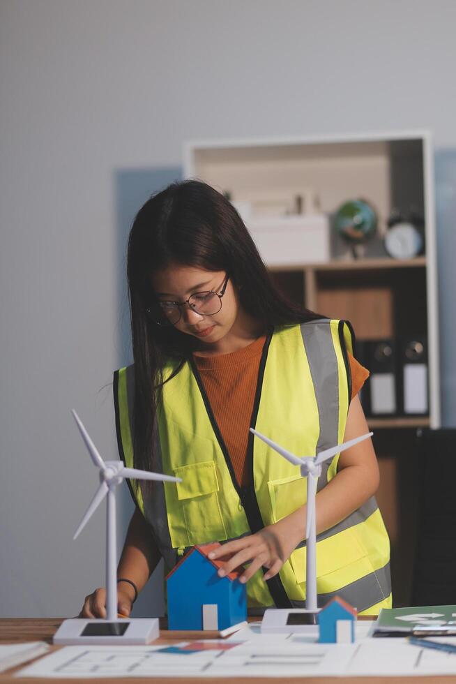 Female architect working at home She looked at the blueprint. photo