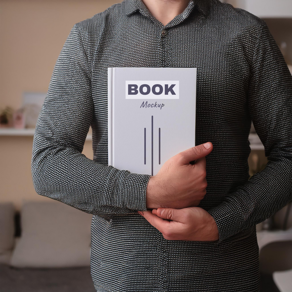 Man holding a book in his hands psd