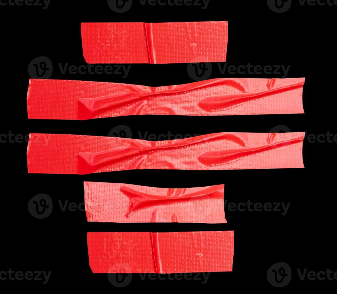 Top view set of wrinkled red adhesive vinyl tape or cloth tape in stripes shape isolated on black background with clipping path photo