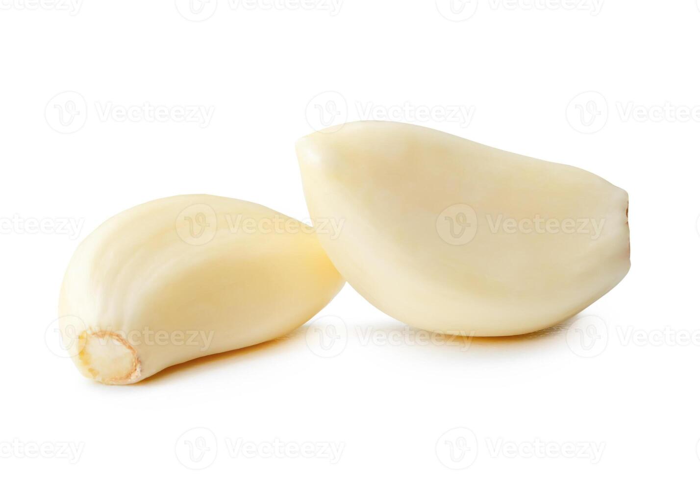 Side view of peeled garlic cloves in stack isolated on white background with clipping path photo