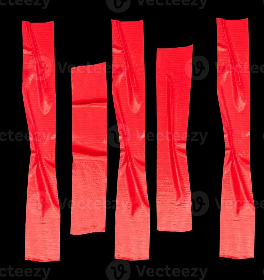 Top view set of wrinkled red adhesive vinyl tape or cloth tape in stripe shape isolated on black background with clipping path photo