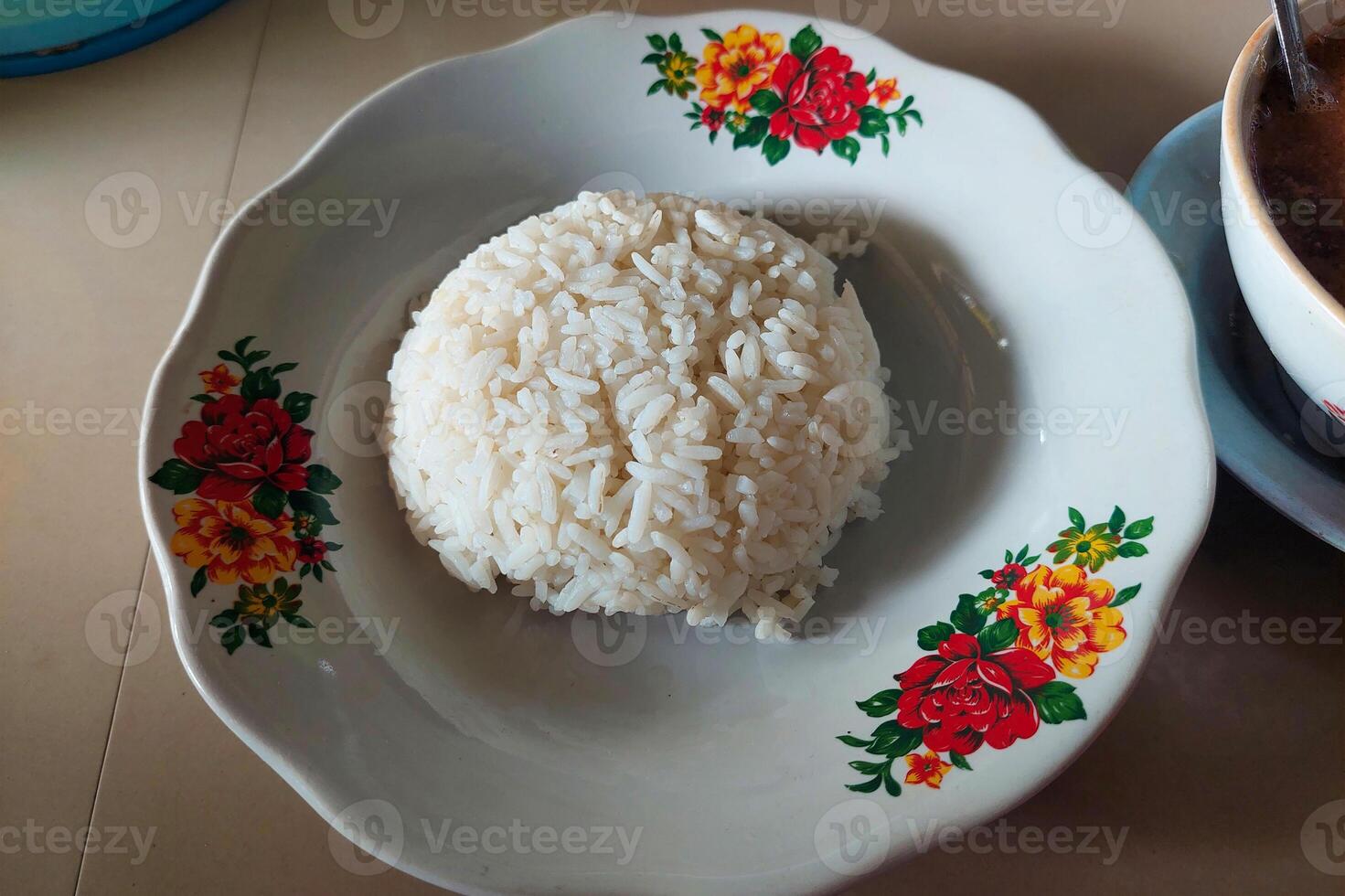 White rice on a plate ready to be eaten on the dining table photo