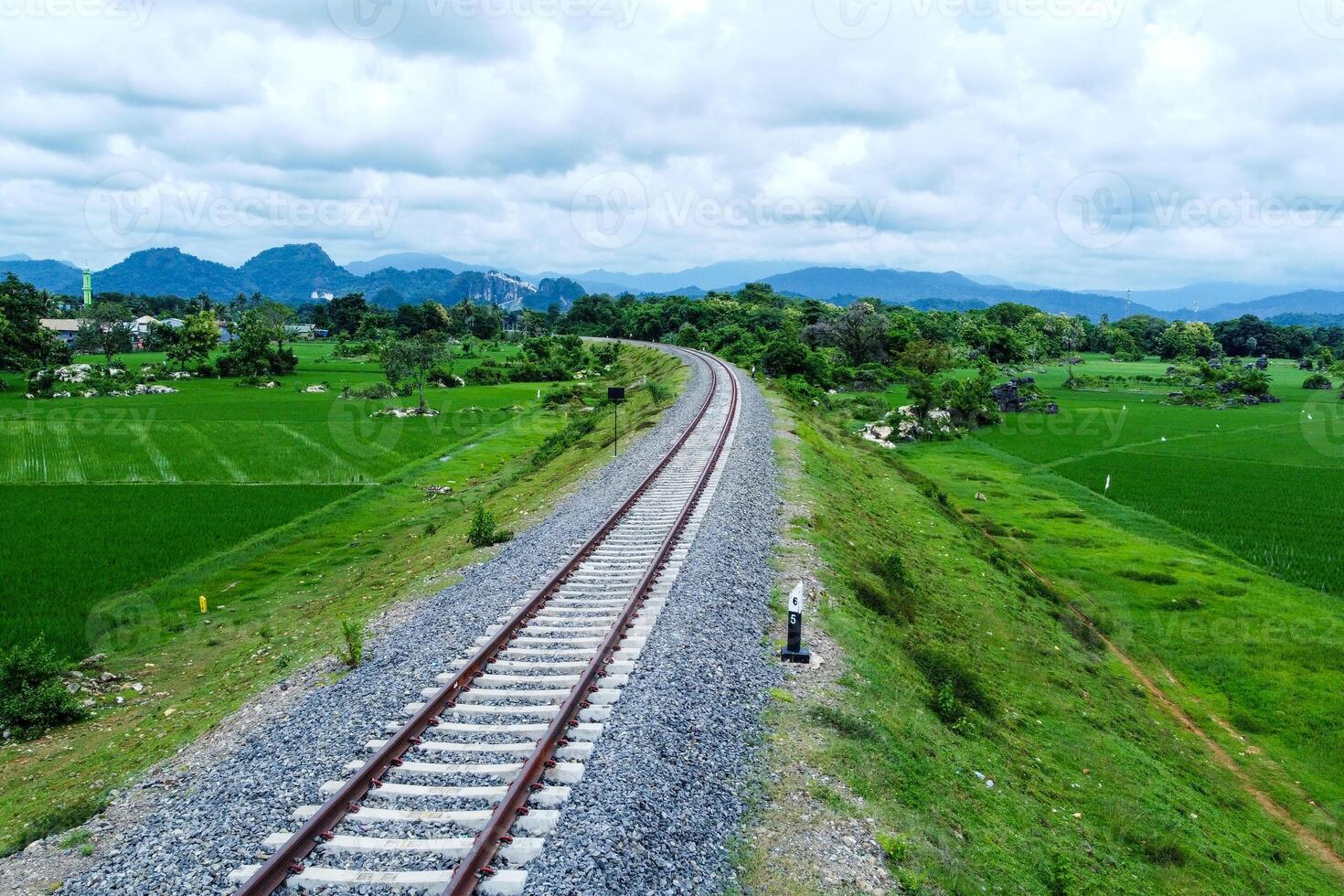 View of railway tracks in rural Indonesia in the afternoon photo