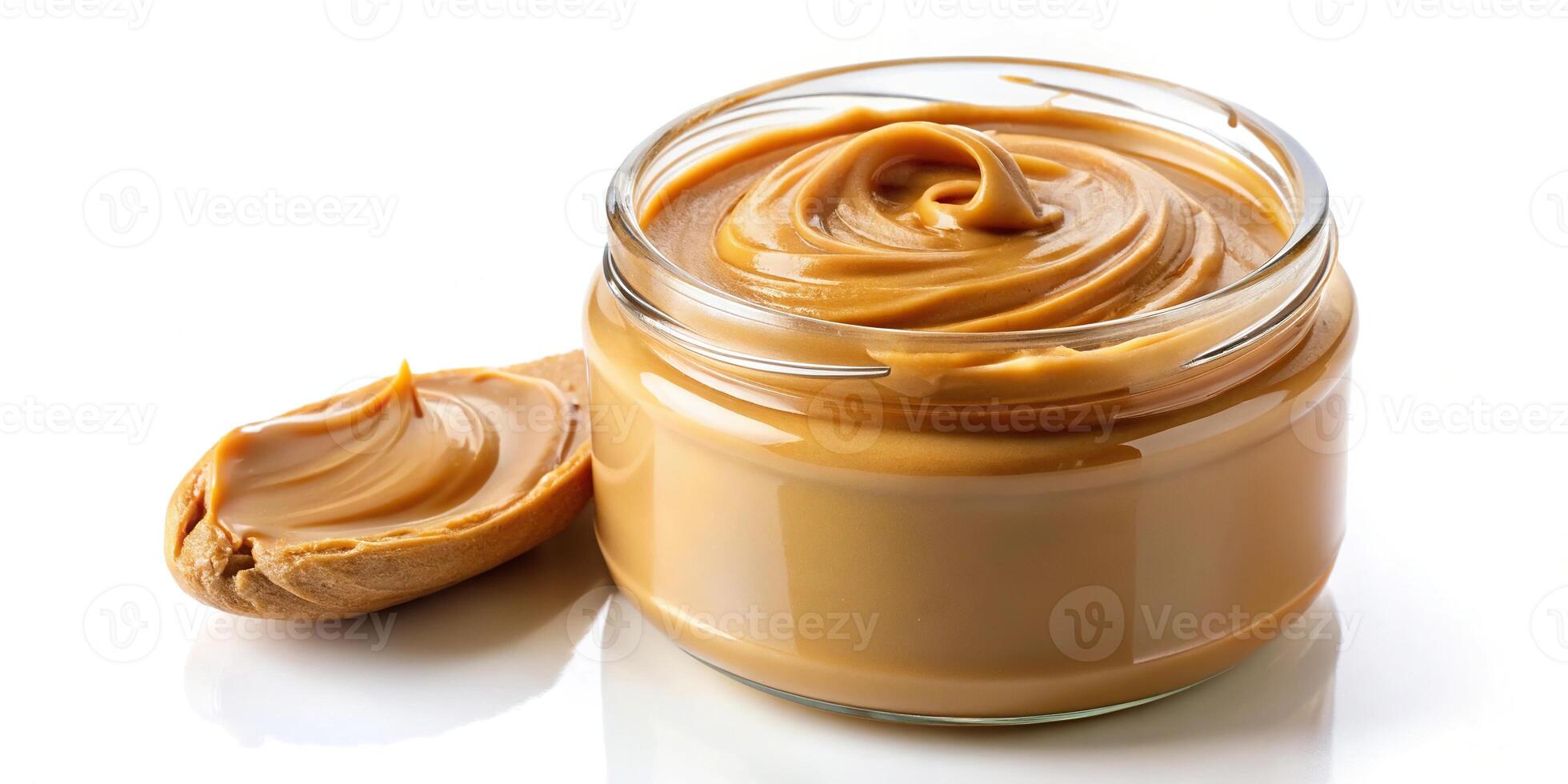 Creamy Peanut Butter Spreading into a Jar Isolated on White Background Worm's Eye View photo