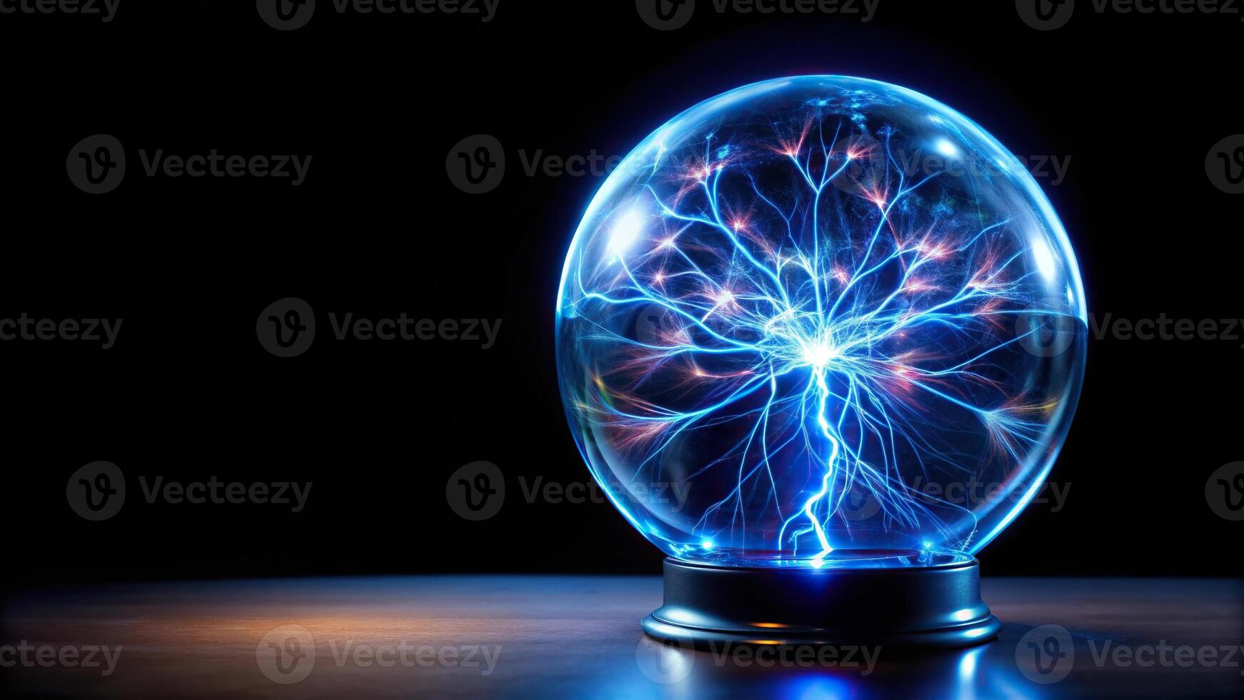 Electric blue crystal ball on black background, bird's eye view photo