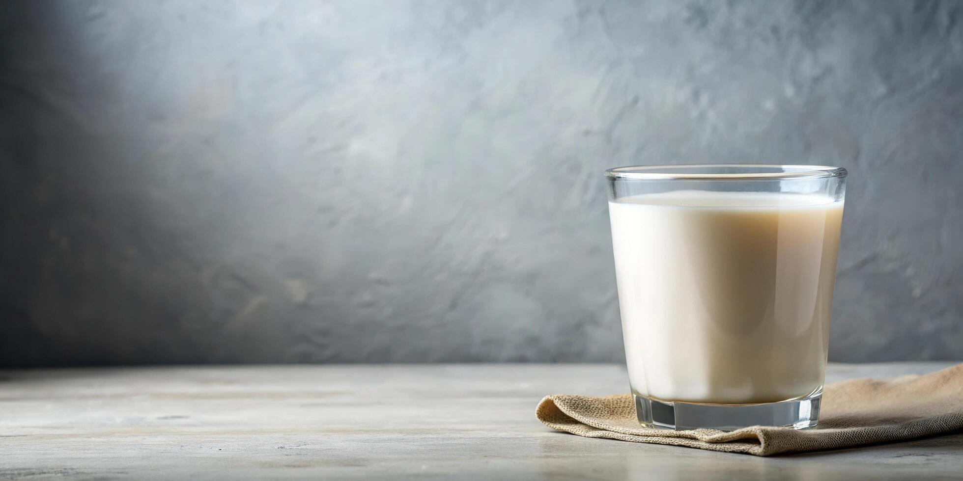 Creamy buttermilk in a clear glass isolated on white background, worm's eye view photo