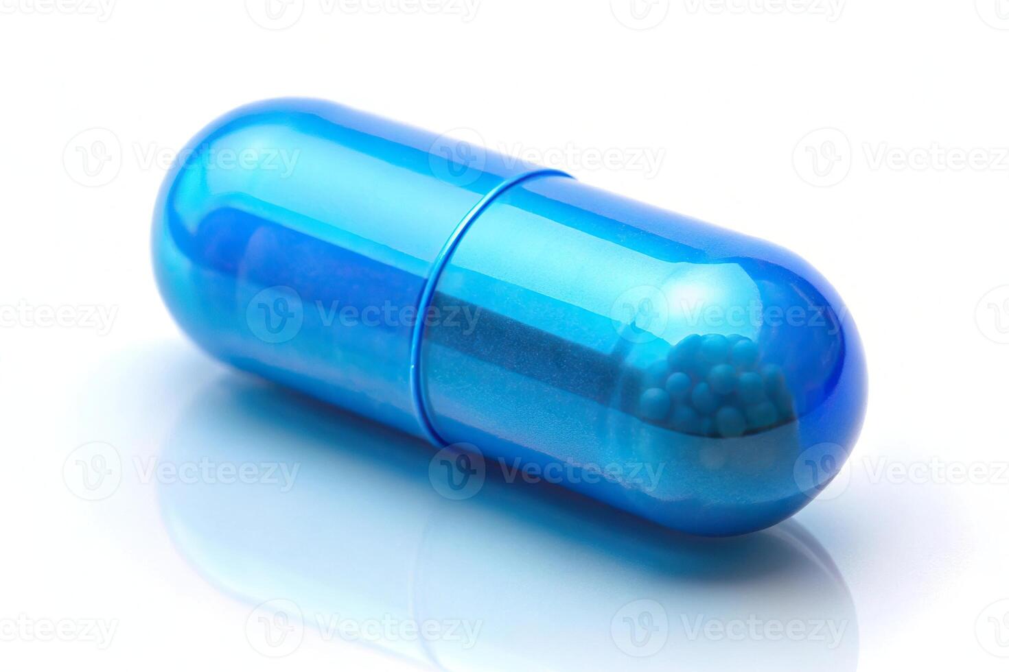 Low angle view of blue pill or capsule filled with vitamin B photo