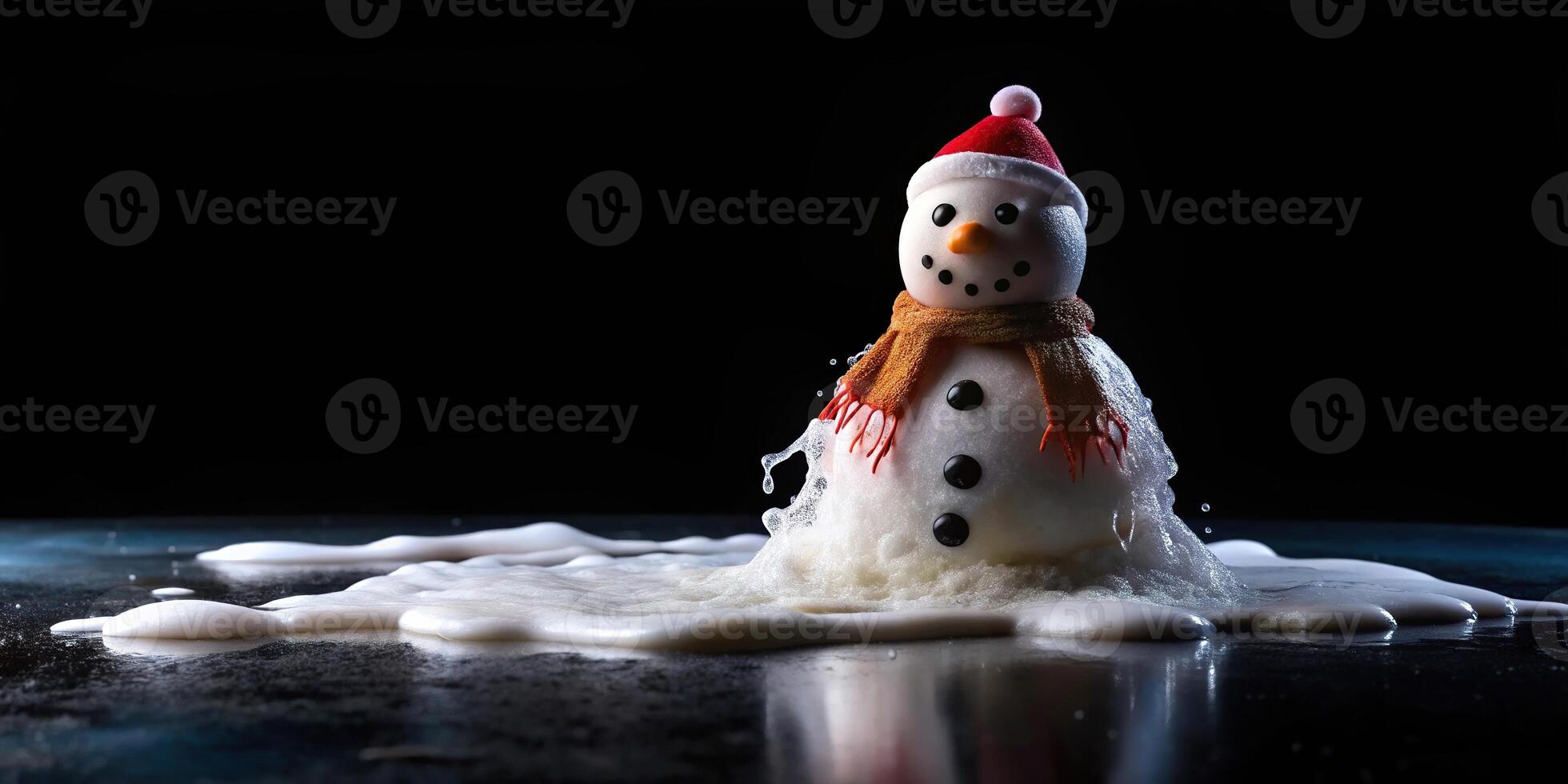 Low angle view of melting snowman against black background at the end of winter photo