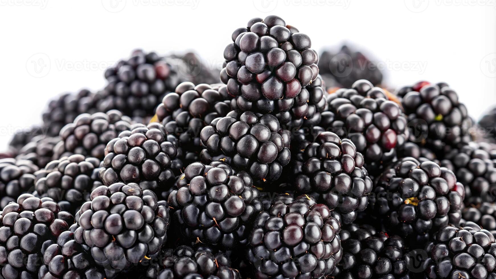 Macro ripe blackberries on a white base with black seeds photo