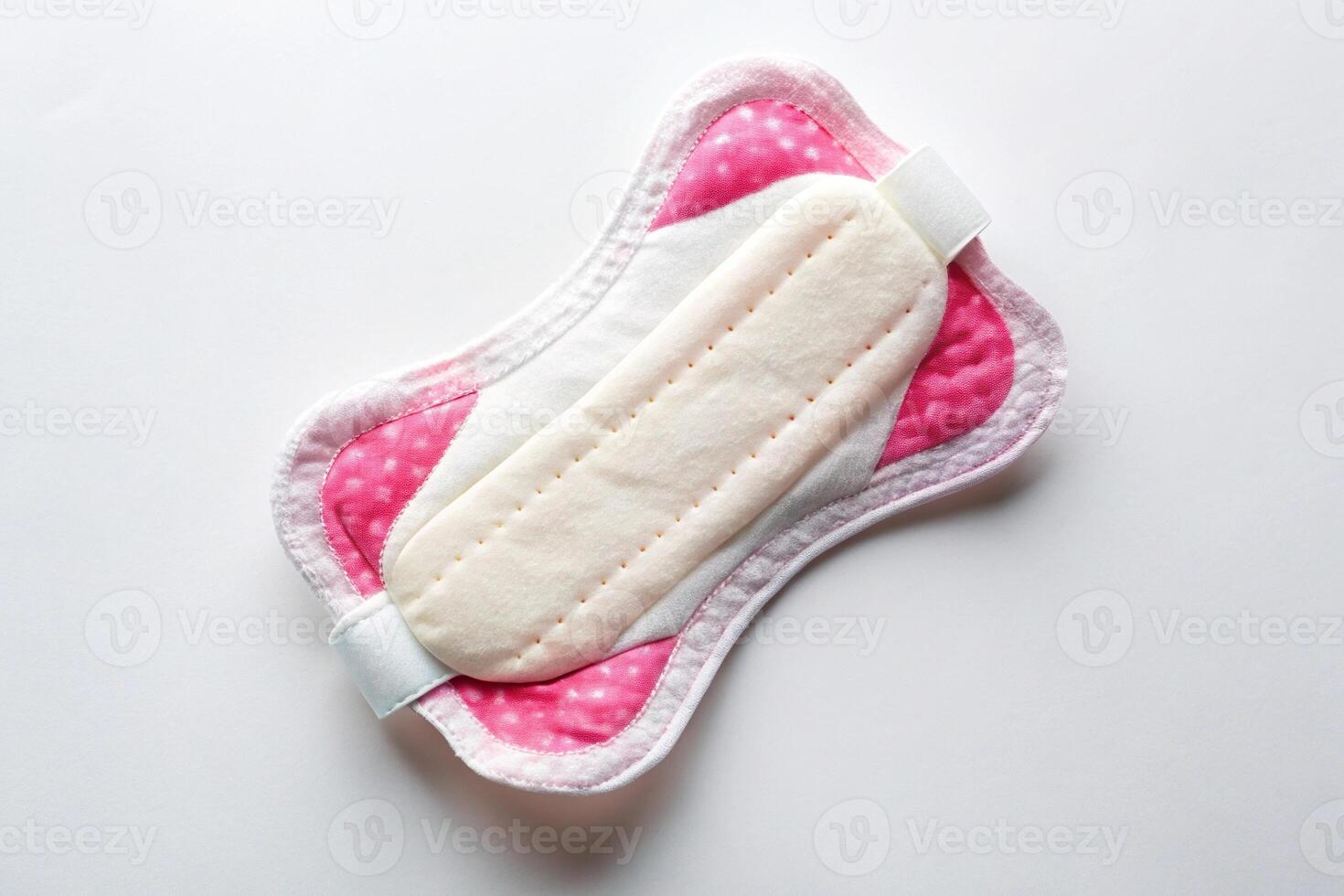 Medium shot of sanitary napkin menstrual pad on white background isolation photo