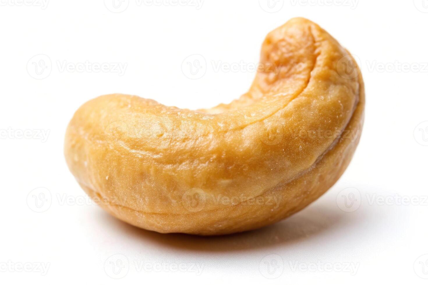 Roasted cashew nut isolated on white at a tilted angle photo