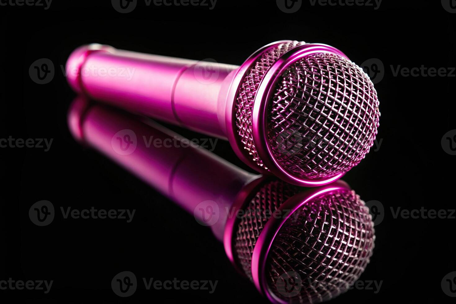 pink wireless microphone on black background macro photo