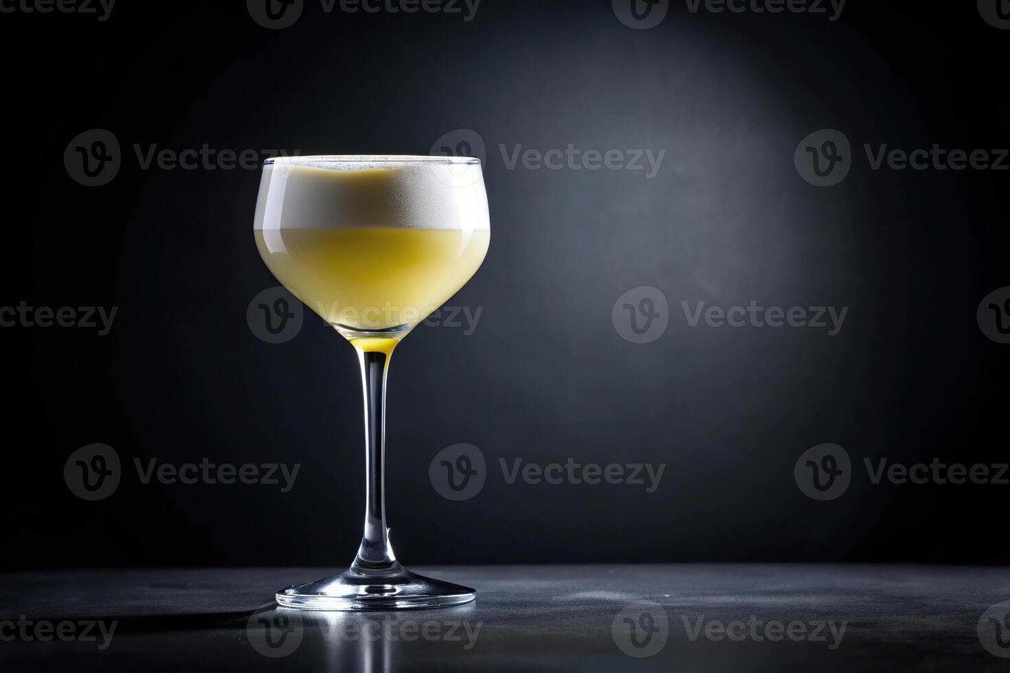 Pisco sour cocktail glass on black background Low Angle photo