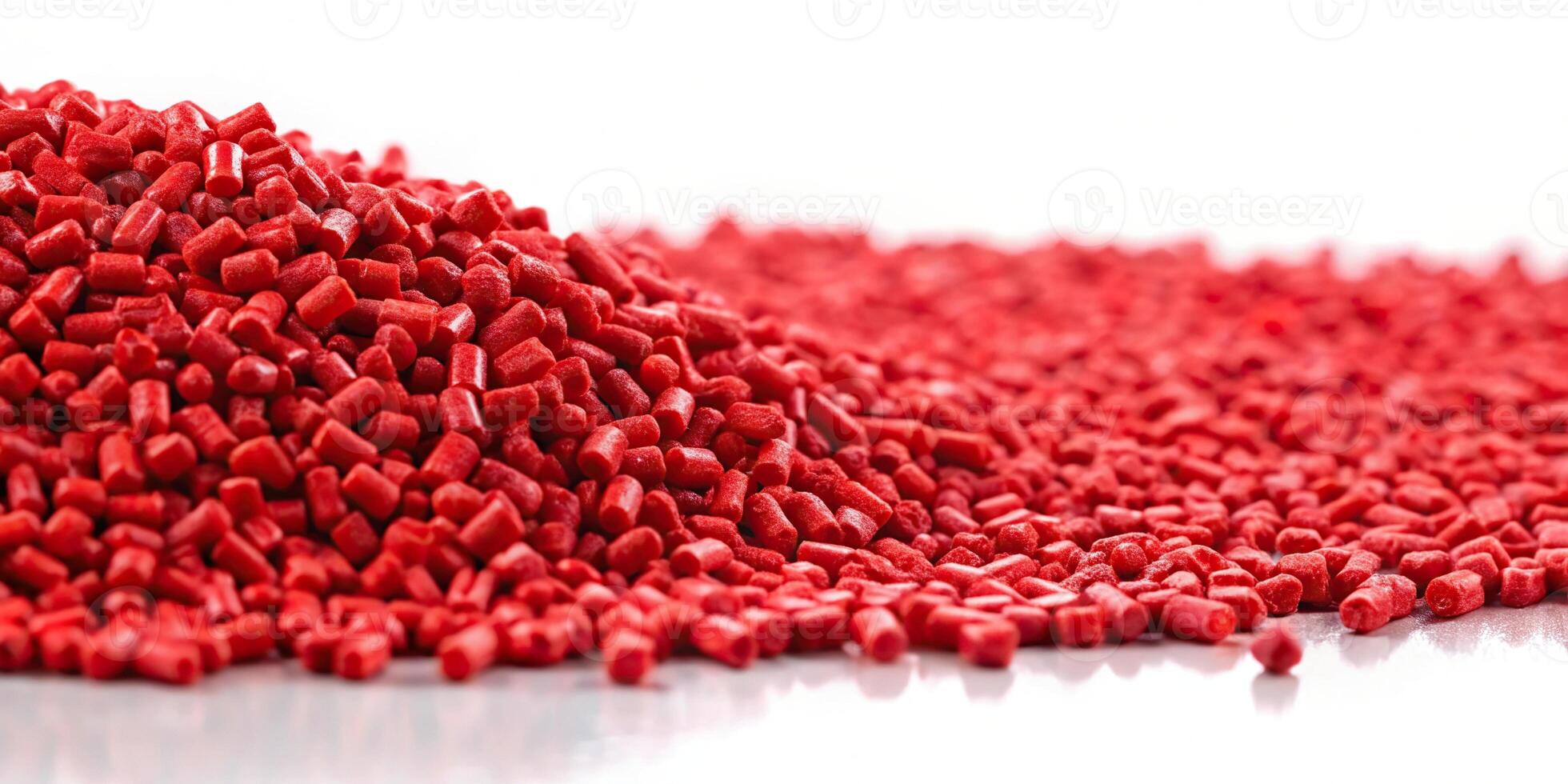 Red plastic polymer granules on white background photo