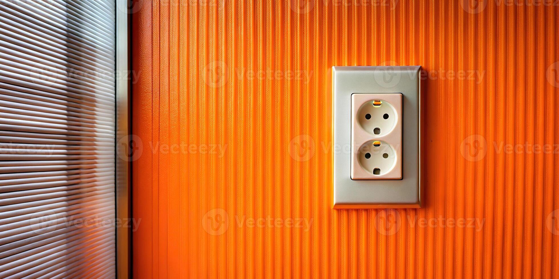 Panoramic electrical outlet on orange metal wall by window photo