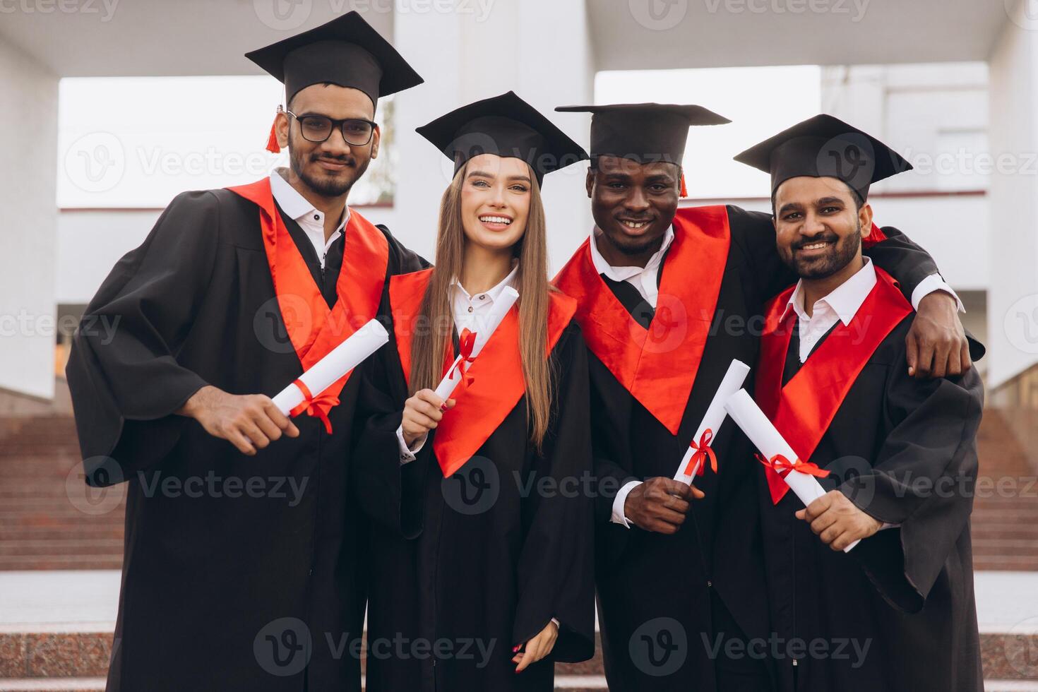 Happy Multicultural Group of Graduates Celebrating Success in Academic Achievement Outdoors photo