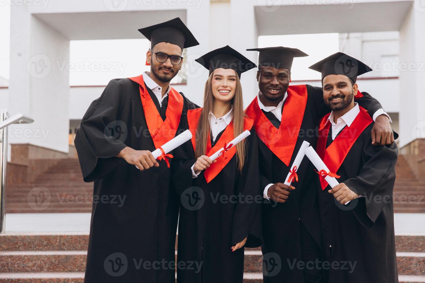 Happy Multicultural Group of Graduates Celebrating Success in Academic Achievement Outdoors photo
