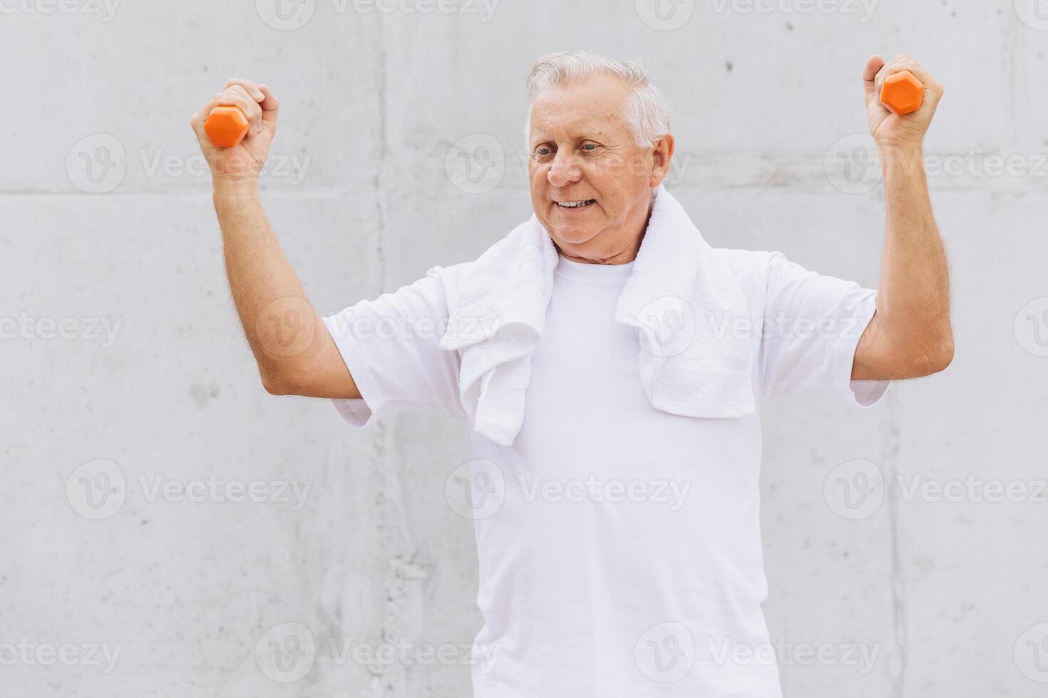 Senior Man Exercising with Dumbbells Outdoors for a Healthy Lifestyle photo