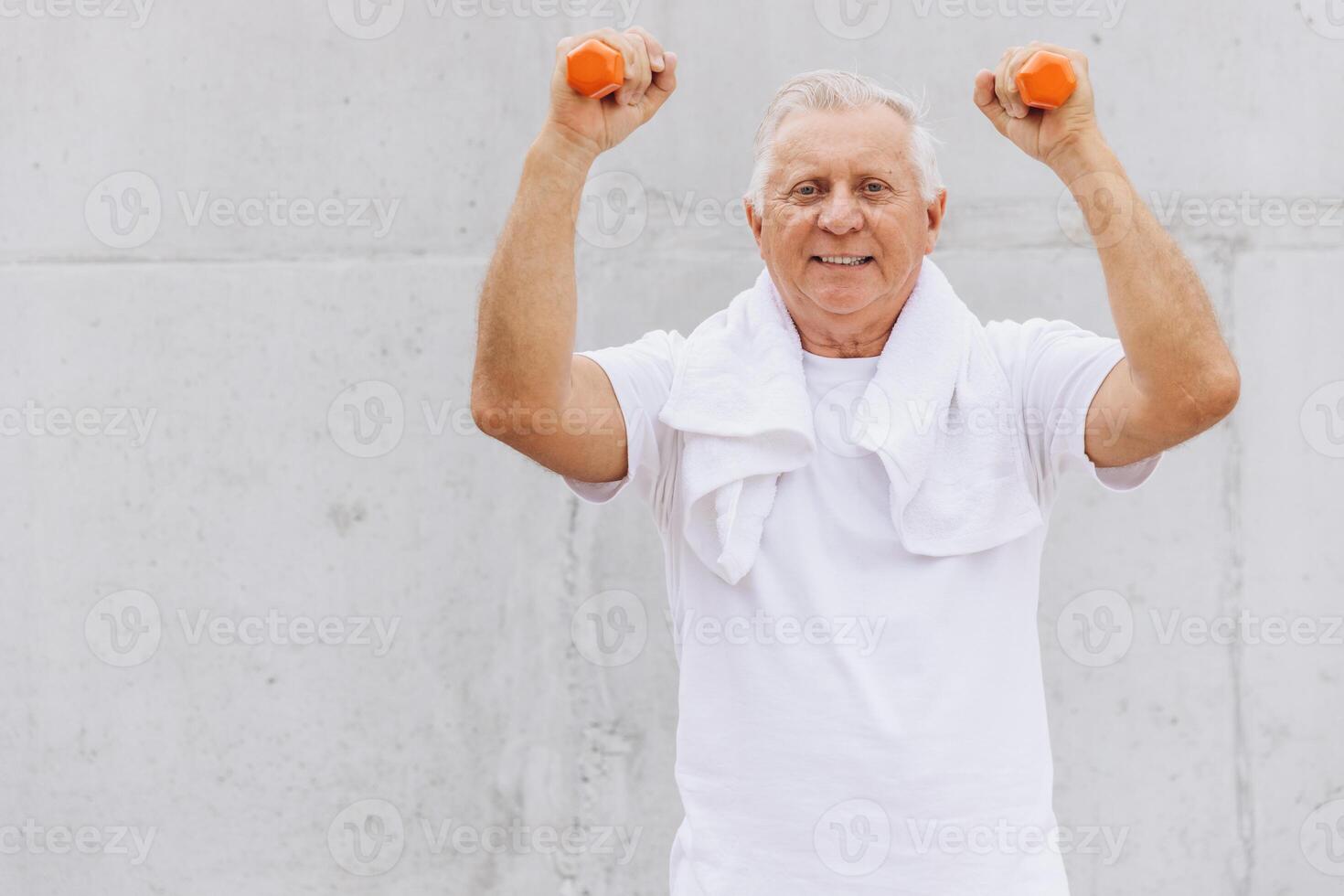 Senior Man Exercising with Dumbbells Outdoors for a Healthy Lifestyle photo
