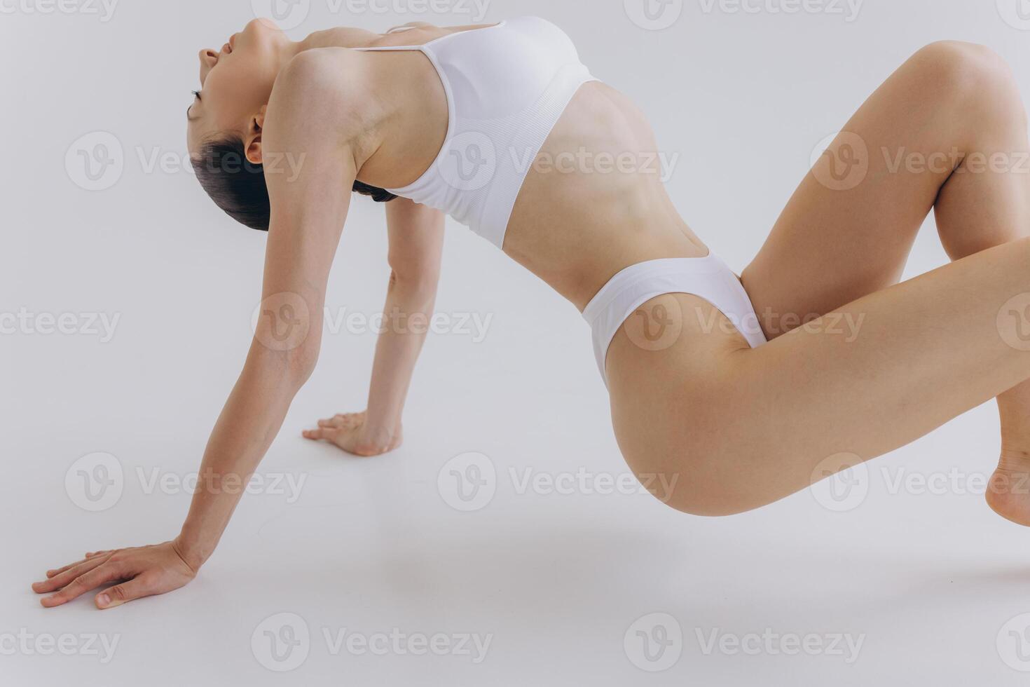 Body Beauty, Slim Woman in White Underwear Lying Down on Back, Happy Dreaming Girl Isolated over White Background with Copy Space, Mock-up photo