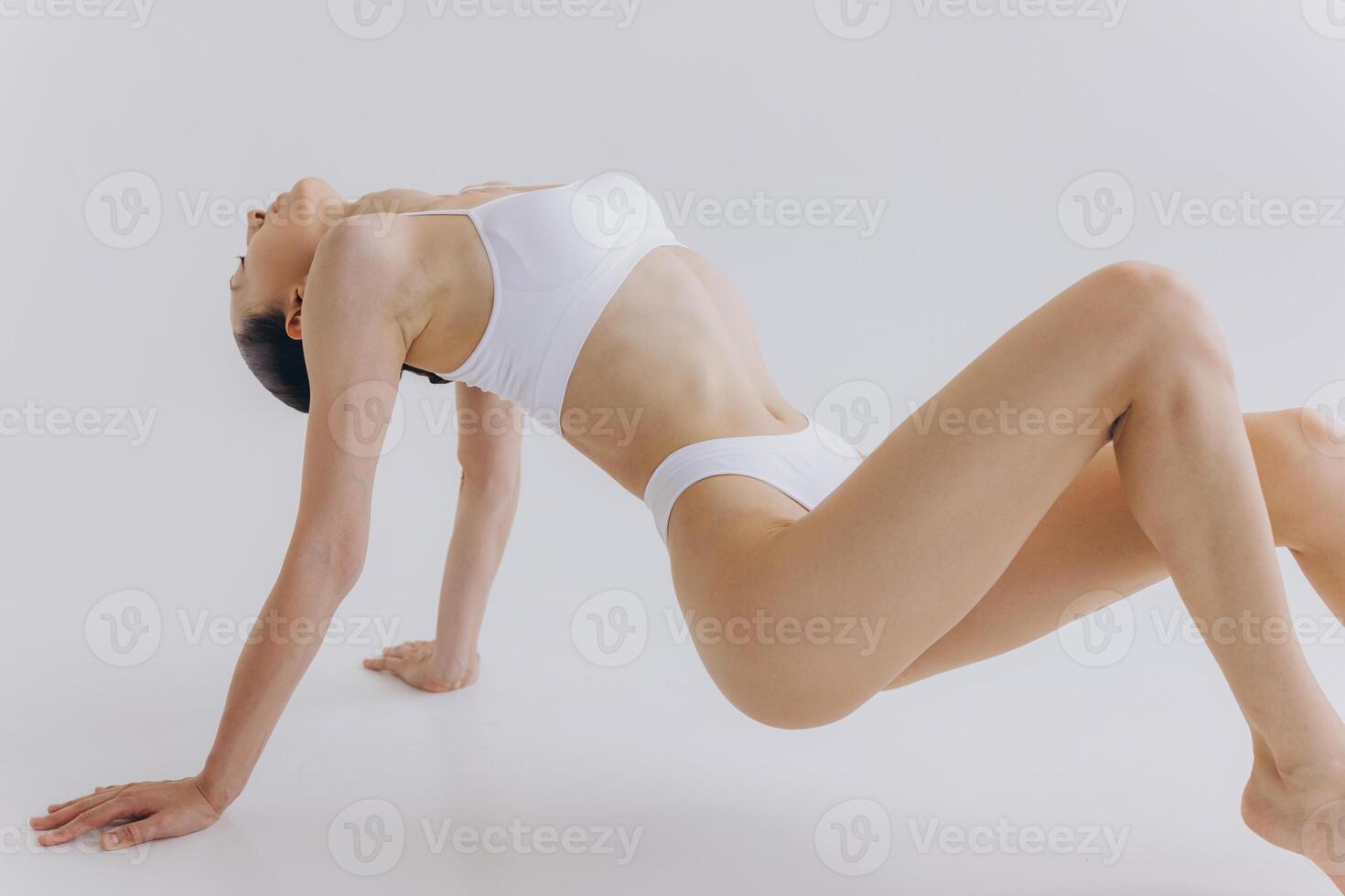 Body Beauty, Slim Woman in White Underwear Lying Down on Back, Happy Dreaming Girl Isolated over White Background with Copy Space, Mock-up photo