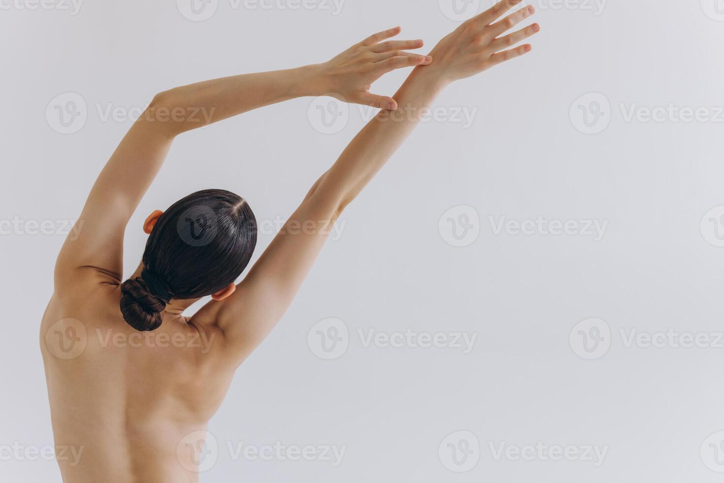 Cropped back rear view young sexy lady woman with slim body perfect skin wearing nude top bra lingerie stand hold hands on thighs isolated on white background. Lifestyle diet fit concept photo