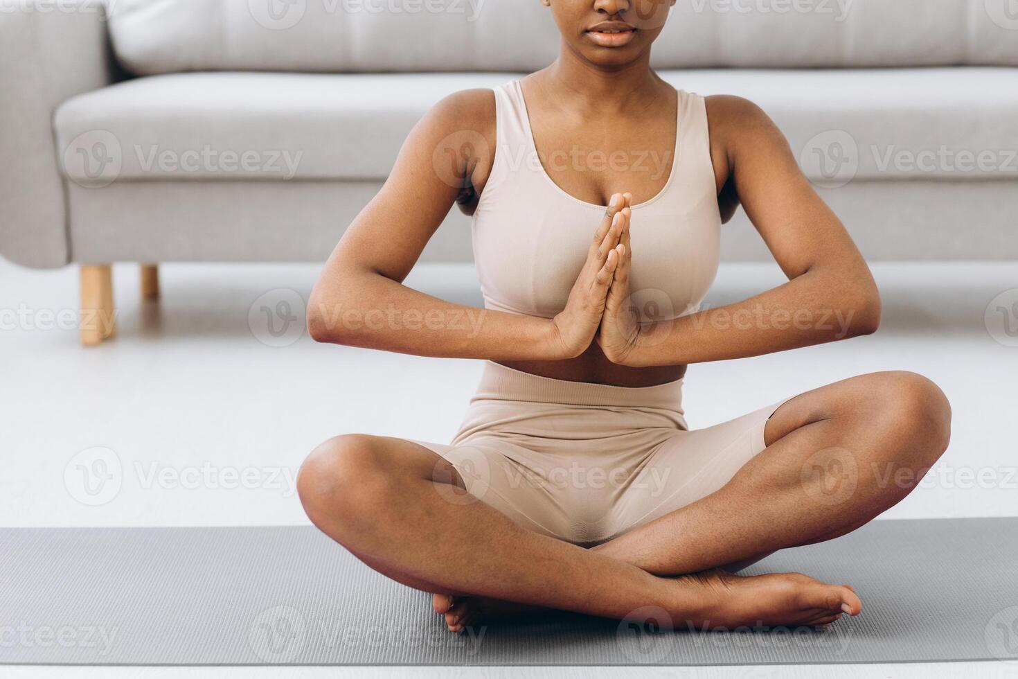 Young black woman meditating at home, yoga online concept, free space photo