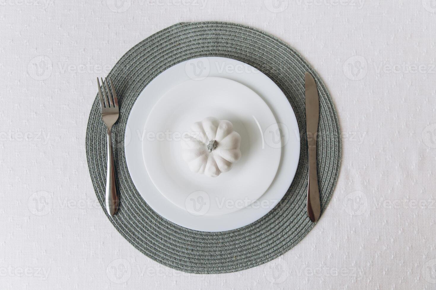 Thanksgiving set. Table setting, white plates with pumpkin, mockup photo