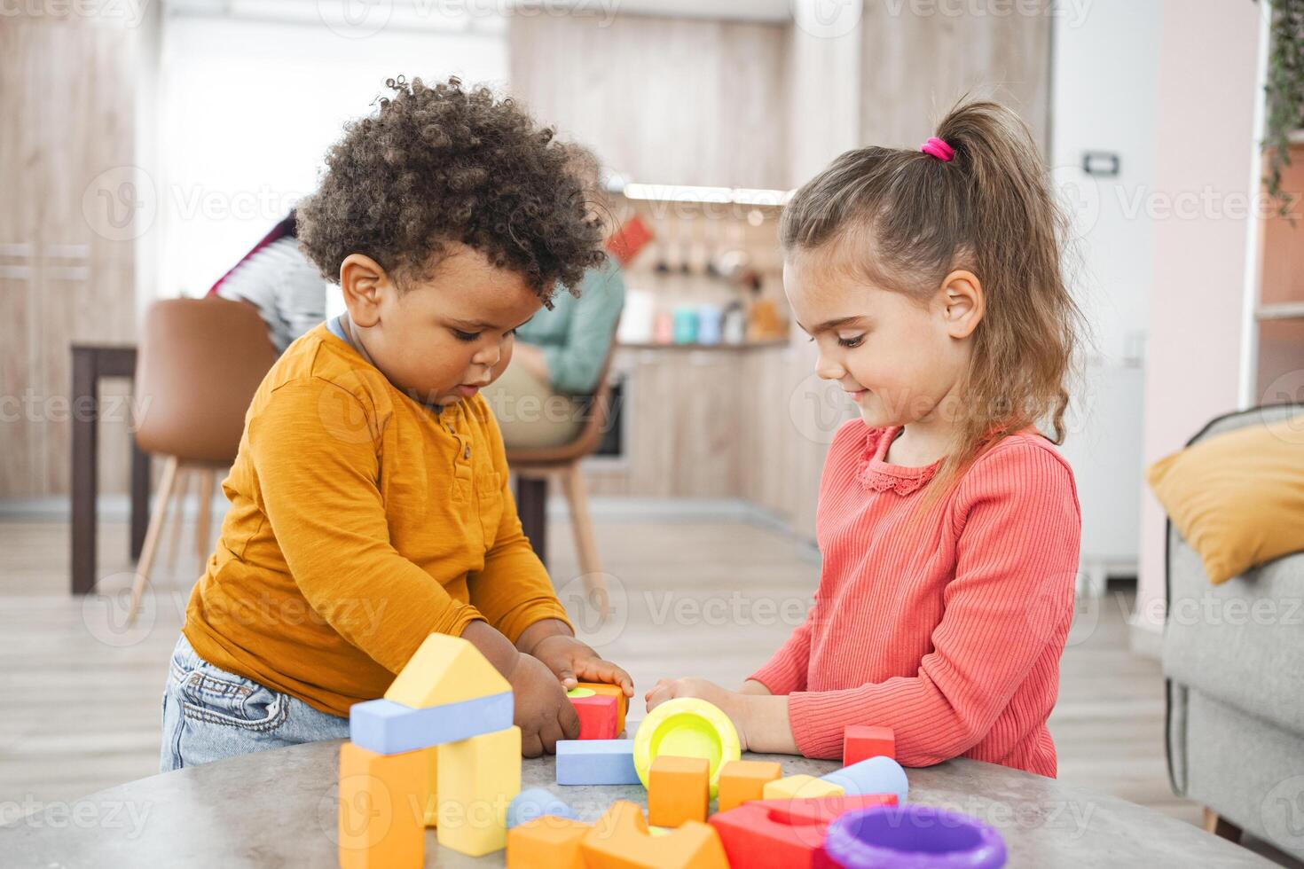Multiracial family spending quality time together indoors on a weekend photo