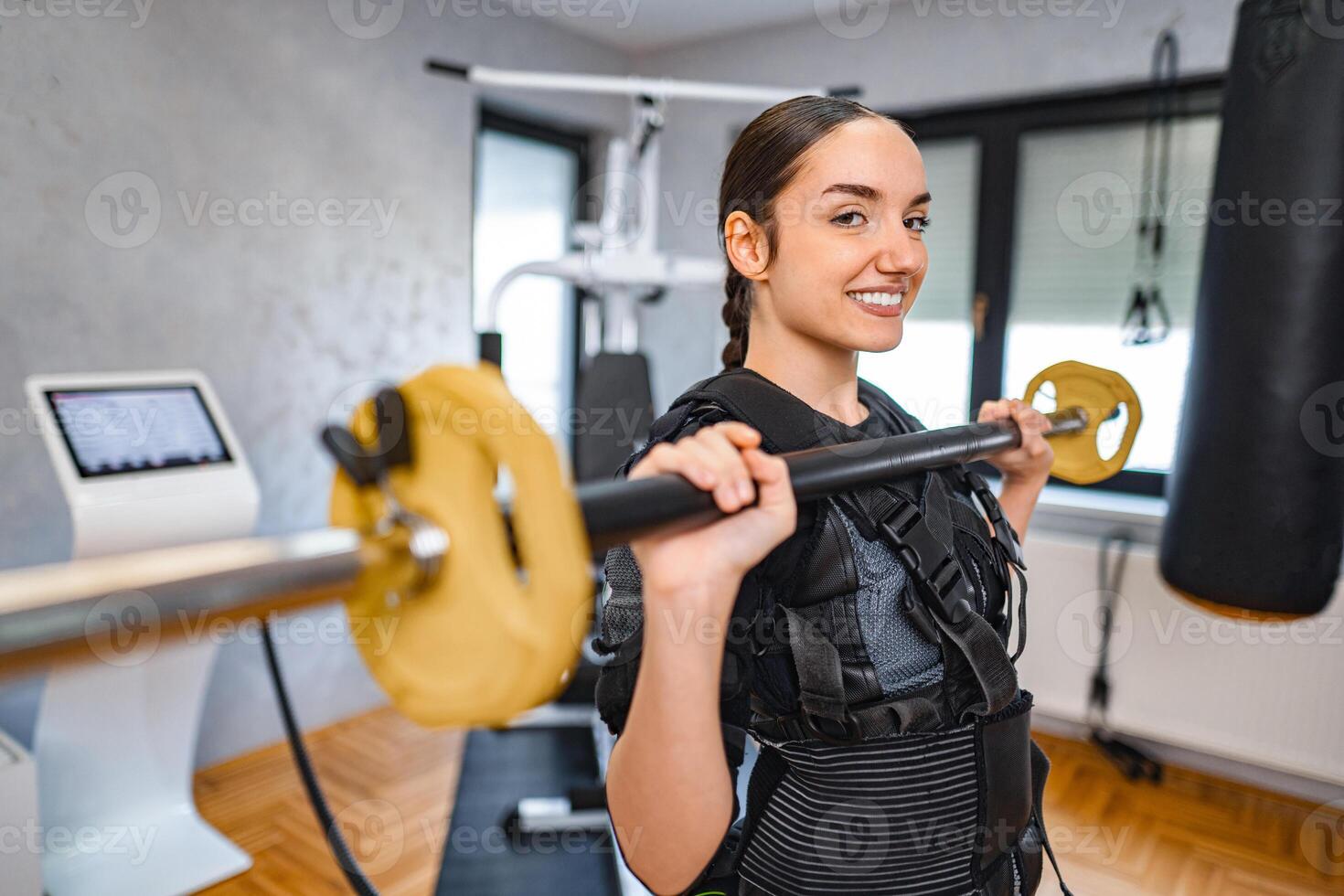 Woman strength training with new equipment photo