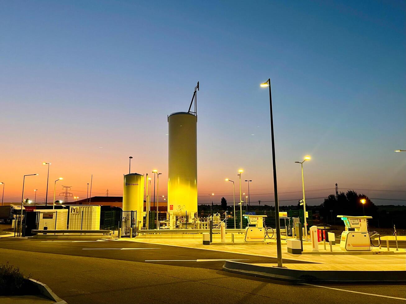 France - 09.18.2024 Sunset at Shell LNG filling station. State-of-the-art liquefied natural gas LNG infrastructure against a picturesque evening sky photo